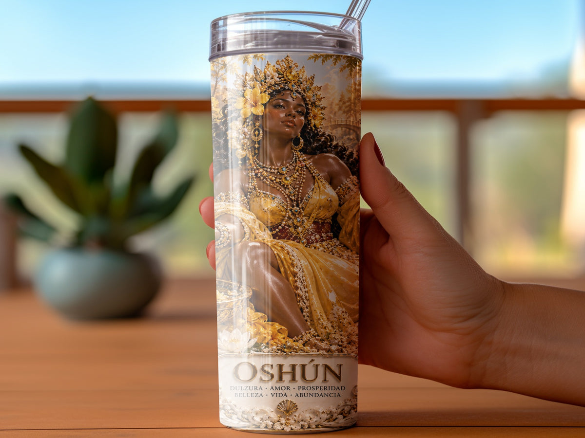 Oshún tumbler with ornate golden goddess design and Spanish text.