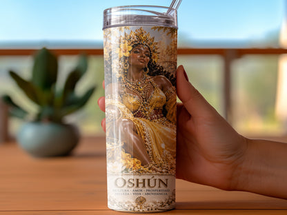 Oshún tumbler with ornate golden goddess design and Spanish text.